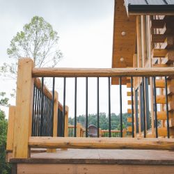 Deck Railing with Square Log Posts and Black Aluminum Spindles