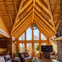 Insulated Log Roof System with Clean Peeled Rustic Log Rafters 